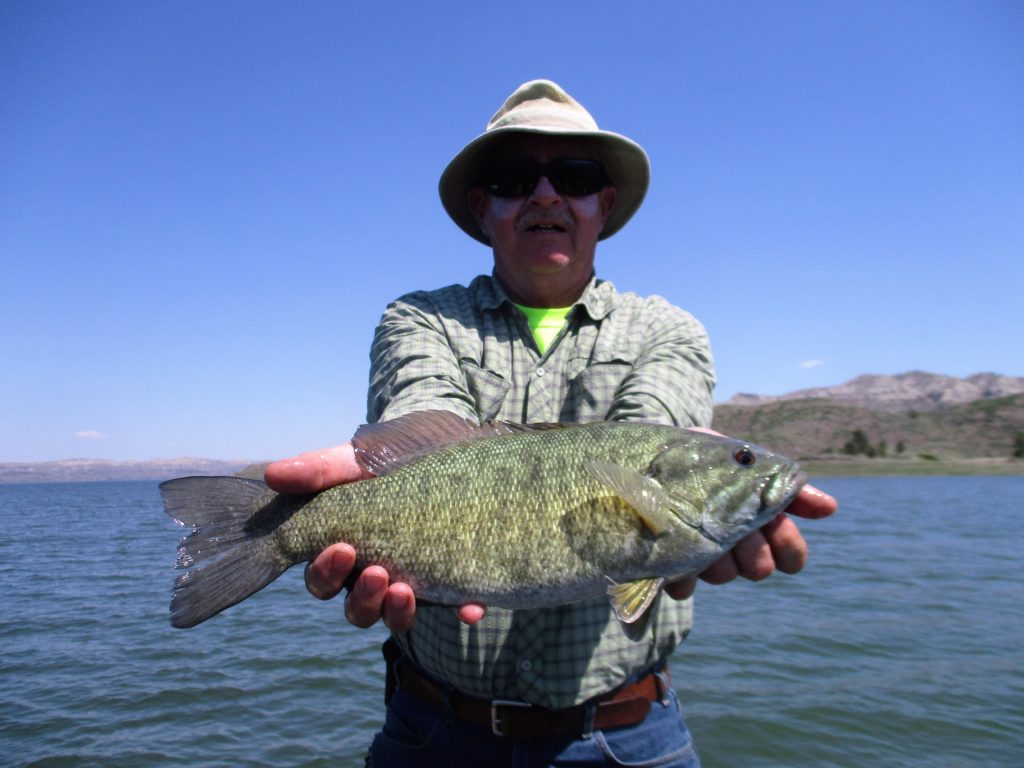 Don Childress of Helena, MT with a 17″, 3 pound smallmouth bass. - Fort Peck Fishing with Matt